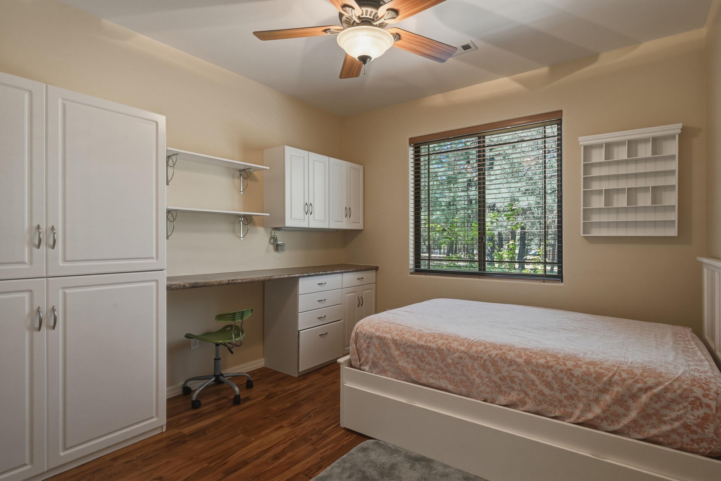 1233 Merzville Road Forest Lakes, AZ 85931 - Photo 25 of 39 a bedroom with a bed and a chandelier