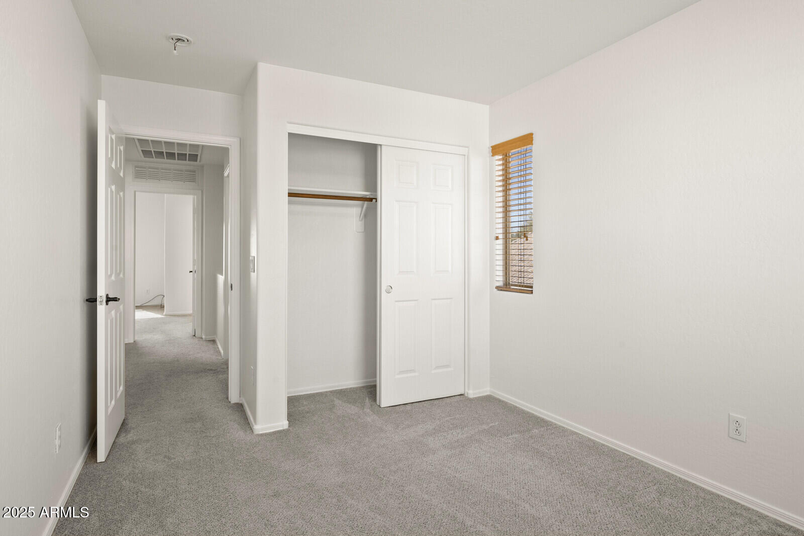 3297 East Warbler Road Gilbert, AZ 85297 - Photo 24 of 32 an empty room with closet and a bathroom