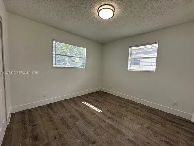 a view of a room with shelf on the wall