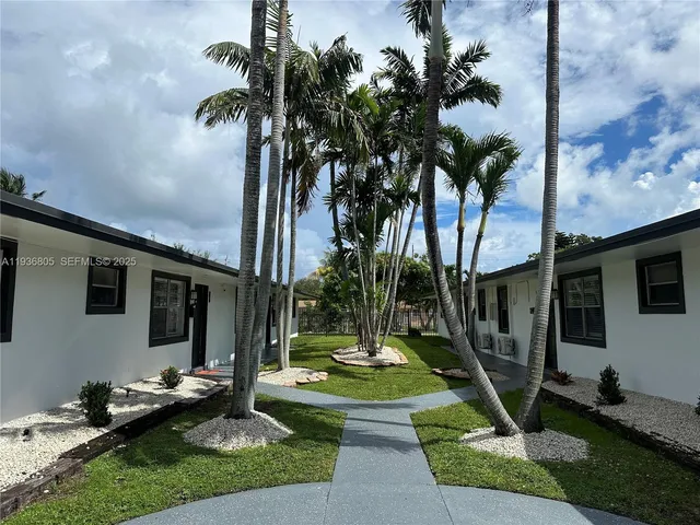 a view of a house with backyard tub and couches