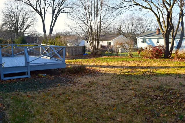 a view of a house with pool and yard