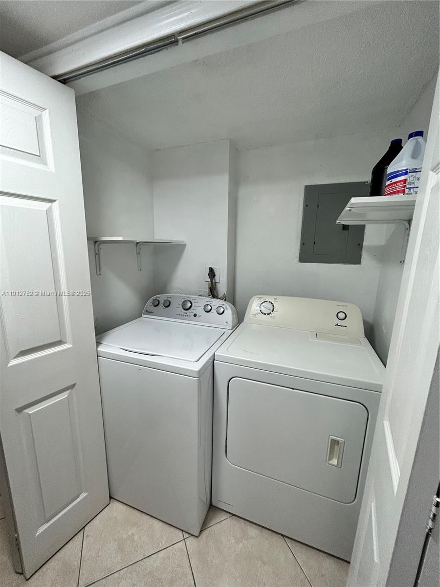 9401 Southwest 4th Street, Unit 111 Miami, FL 33174 - Photo 9 of 12 a utility room with dryer and washer