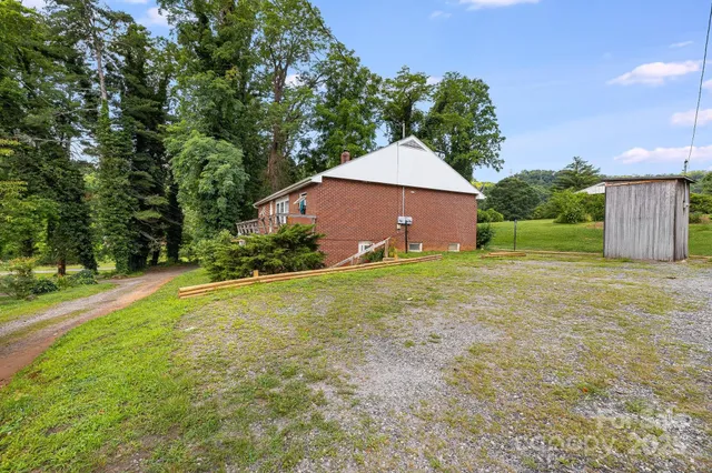 a view of a garden with a building in the background