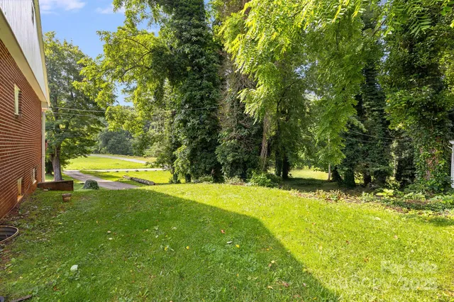 a view of a lake in middle of the green field