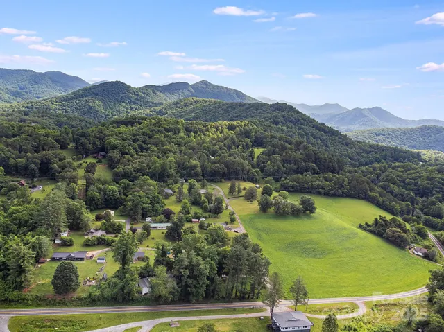a view of a lake with houses in the back