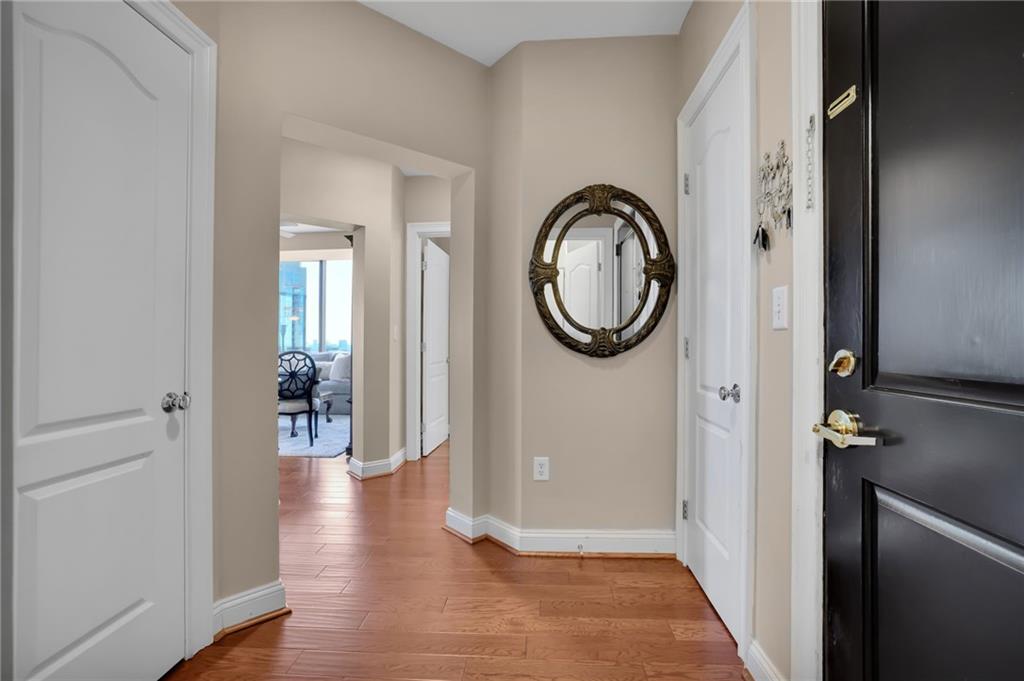 2828 Peachtree Road Northwest, Unit 1901 Atlanta, GA 30305 - Photo 4 of 35 a view of a hallway with wooden floor