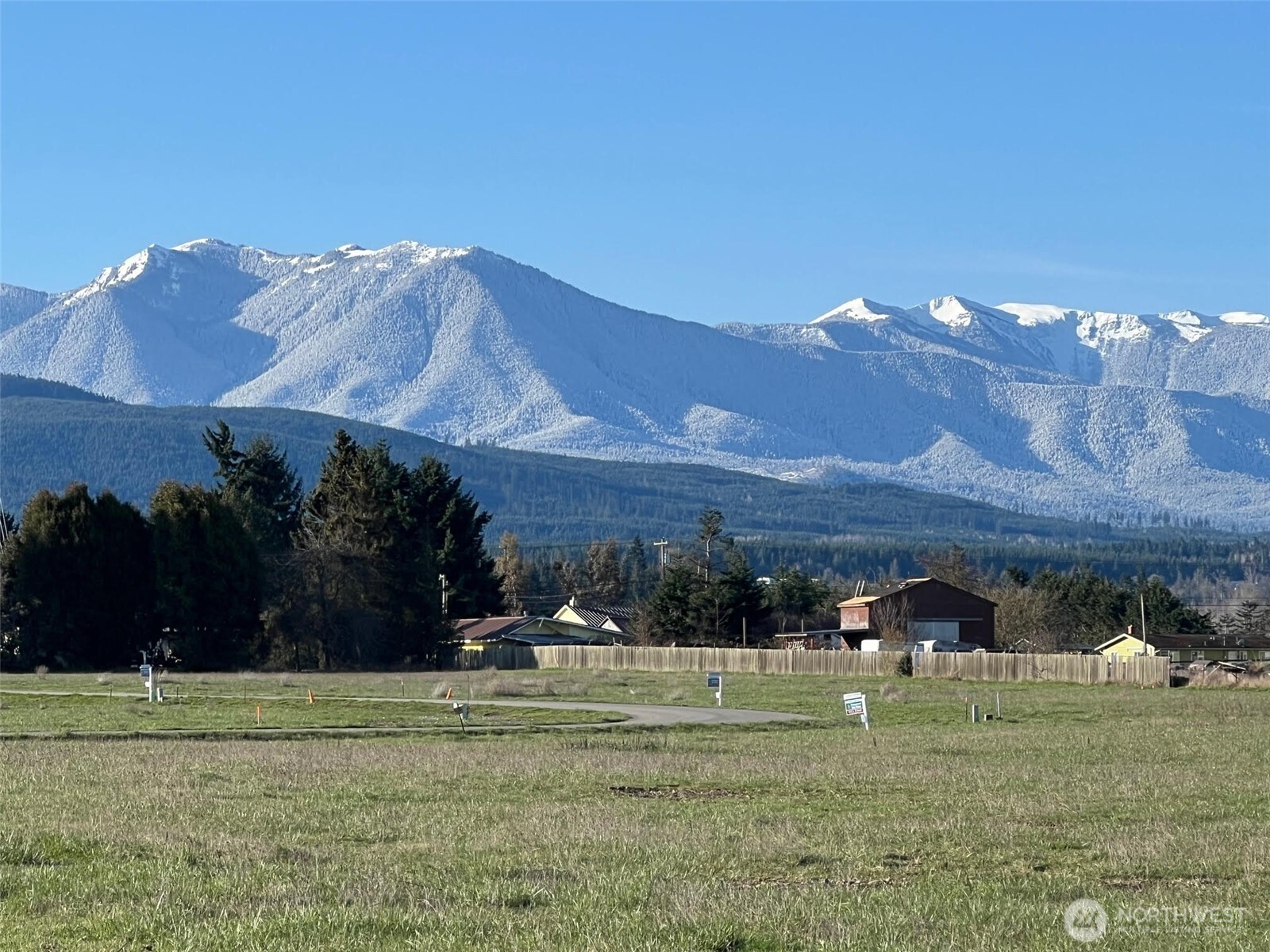 9999 Lange Lane Sequim, WA 98382 - Photo 16 of 16 a view of a big house with a big yard and a large trees