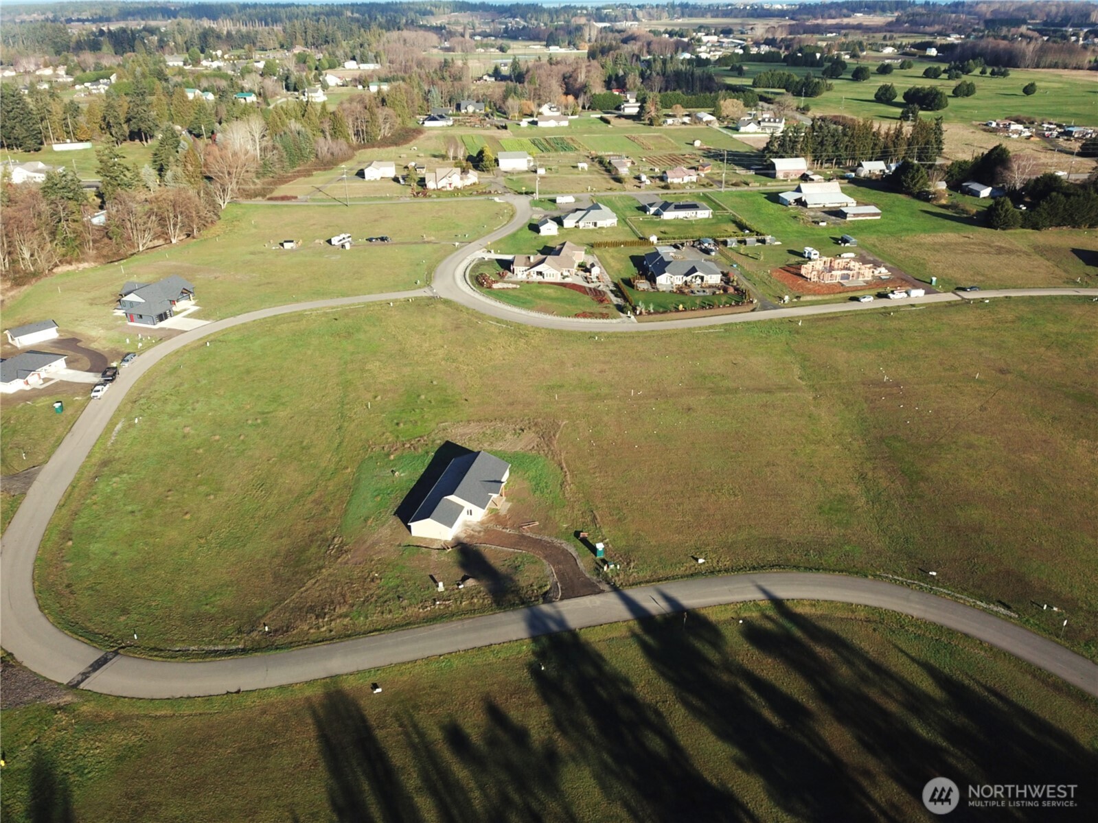 9999 Lange Lane Sequim, WA 98382 - Photo 6 of 16 an aerial view of a house with a swimming pool