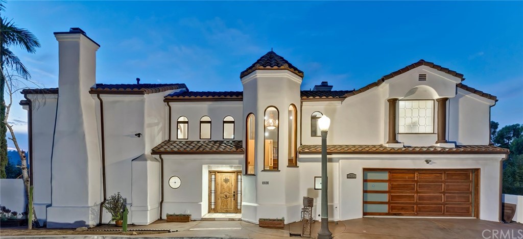 3263 Tareco Drive Los Angeles, CA 90068 - Photo 1 of 71 a front view of a house with large windows