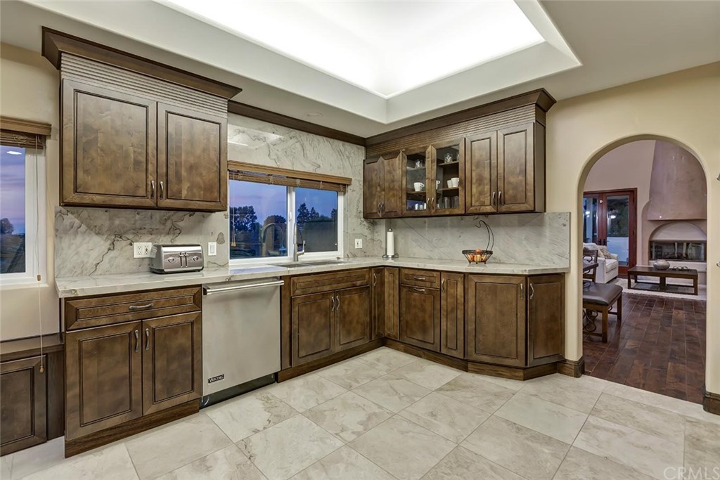 3263 Tareco Drive Los Angeles, CA 90068 - Photo 11 of 71 a kitchen with stainless steel appliances granite countertop a stove a sink and a microwave