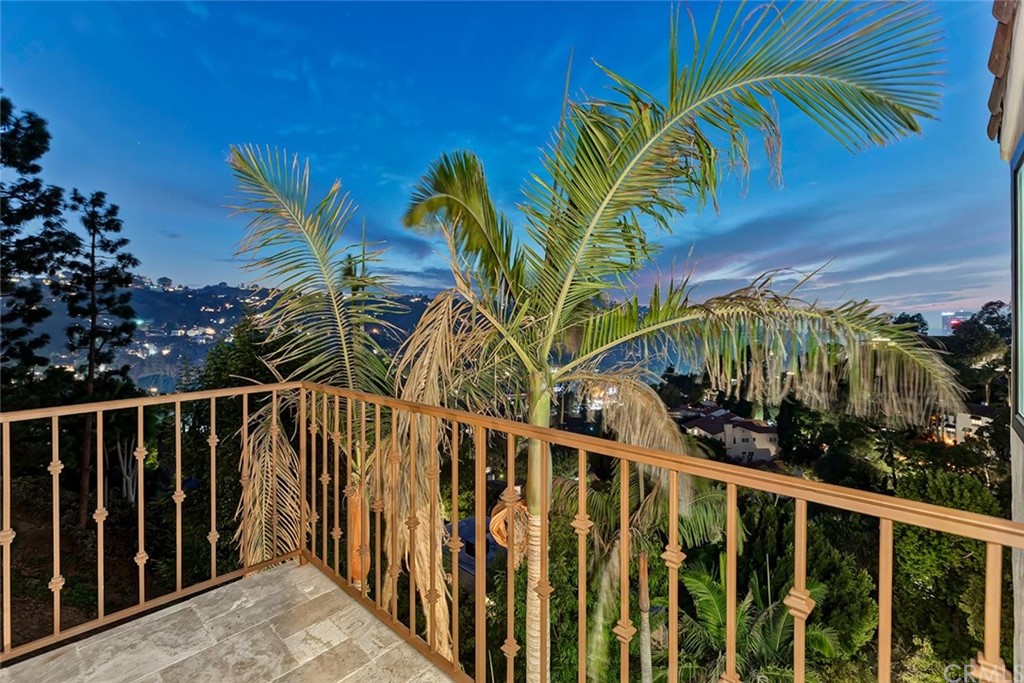 3263 Tareco Drive Los Angeles, CA 90068 - Photo 26 of 71 a view of a palm tree with wooden fence