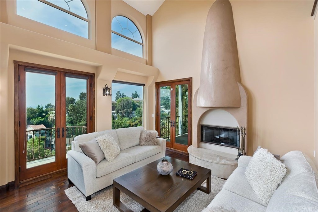 3263 Tareco Drive Los Angeles, CA 90068 - Photo 28 of 71 a living room with furniture a window and a fireplace