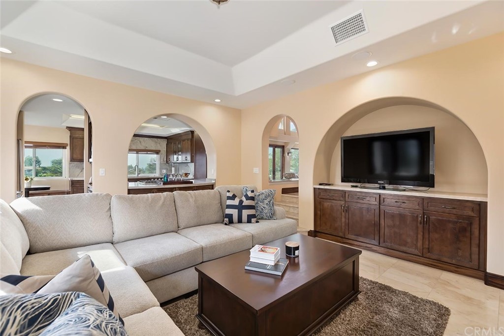 3263 Tareco Drive Los Angeles, CA 90068 - Photo 45 of 71 a living room with furniture and a flat screen tv