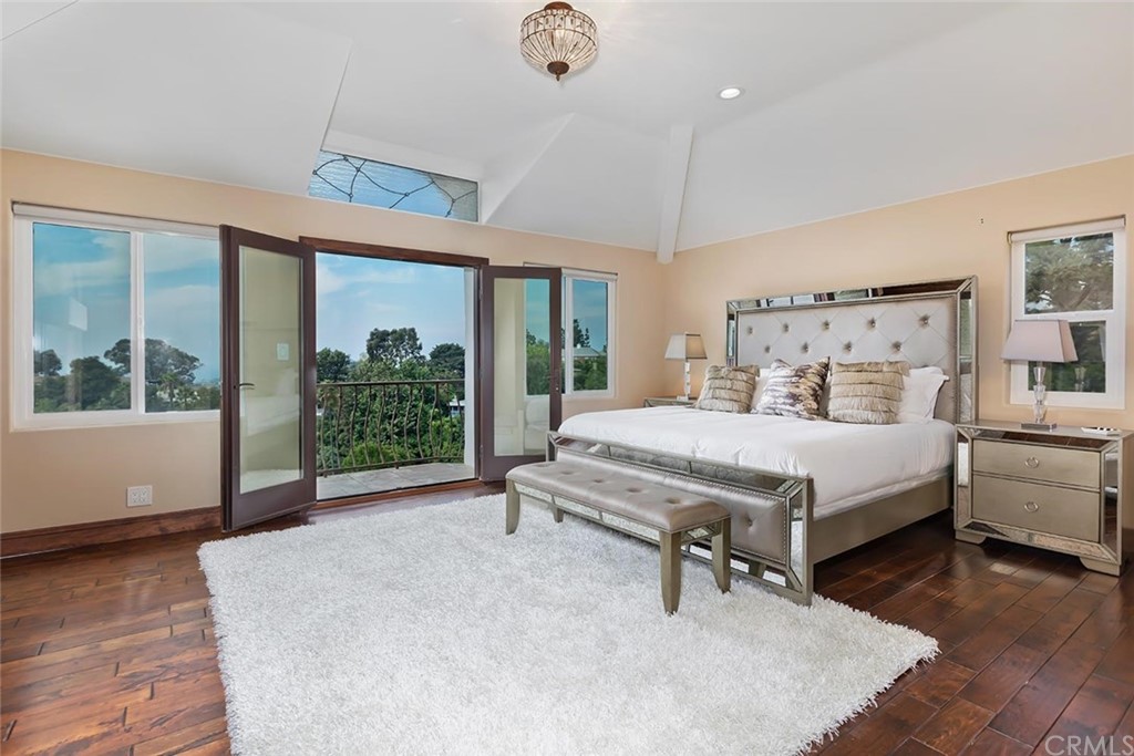 3263 Tareco Drive Los Angeles, CA 90068 - Photo 55 of 71 a bedroom with a large bed and a large window