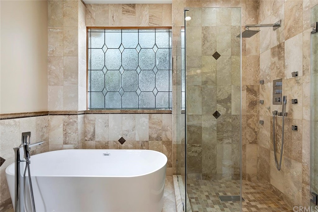 3263 Tareco Drive Los Angeles, CA 90068 - Photo 62 of 71 a white bath tub sitting next to a shower