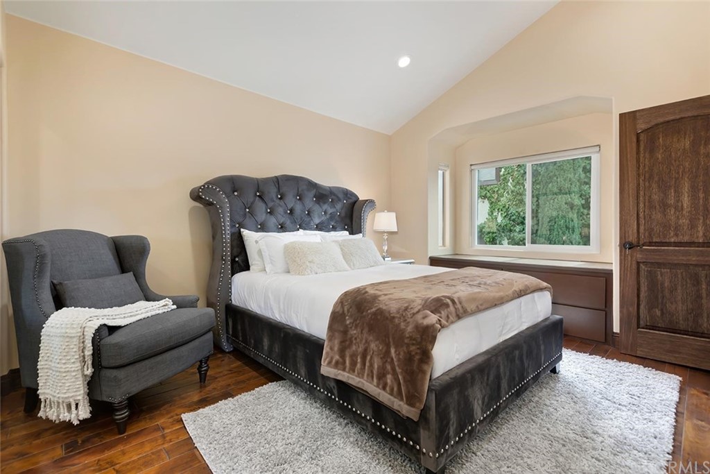 3263 Tareco Drive Los Angeles, CA 90068 - Photo 64 of 71 a bedroom with a bed couch and a window