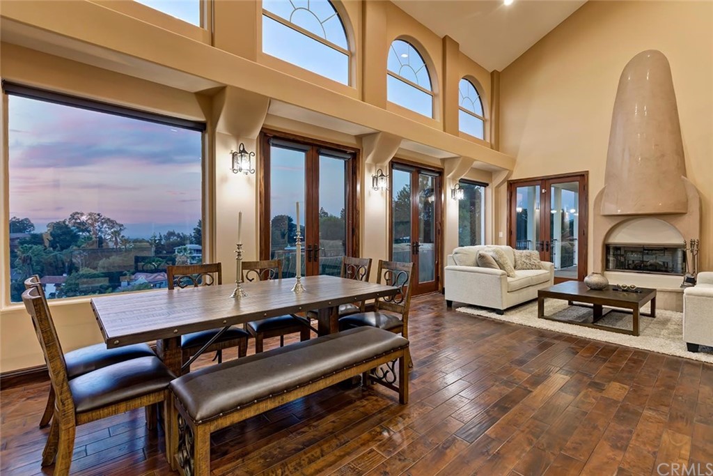 3263 Tareco Drive Los Angeles, CA 90068 - Photo 9 of 71 a living room with furniture a fireplace and large windows