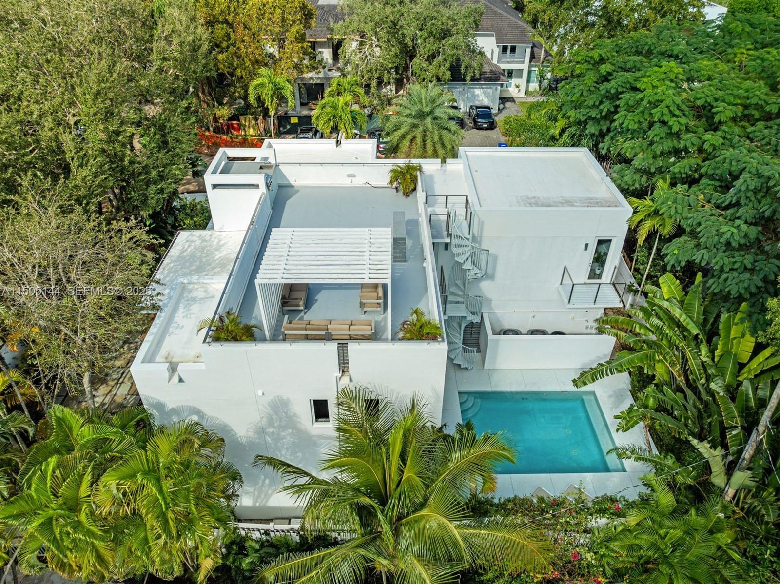 an aerial view of a house with a garden