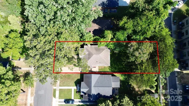 an aerial view of house with yard swimming pool and outdoor seating