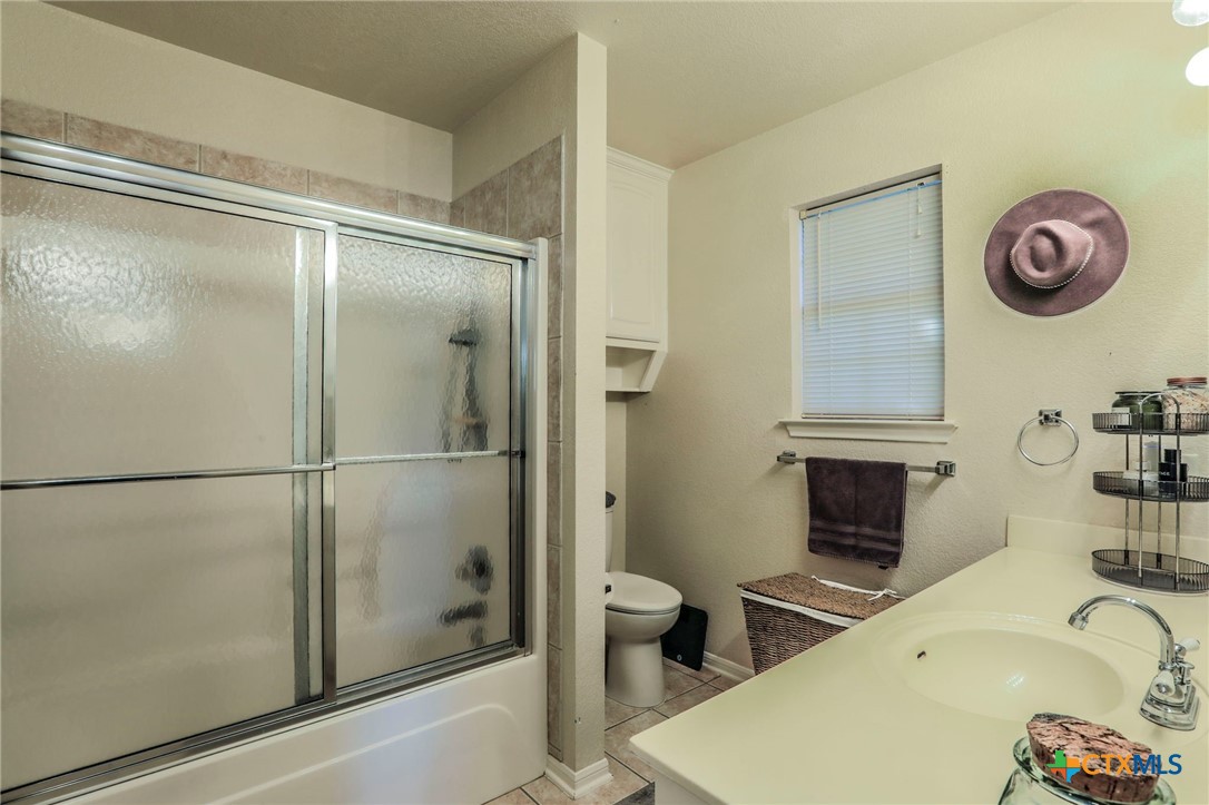 17 South Archer Drive Morgan's Point Resort, TX 76513 - Photo 13 of 30 a bathroom with a sink a toilet and a shower