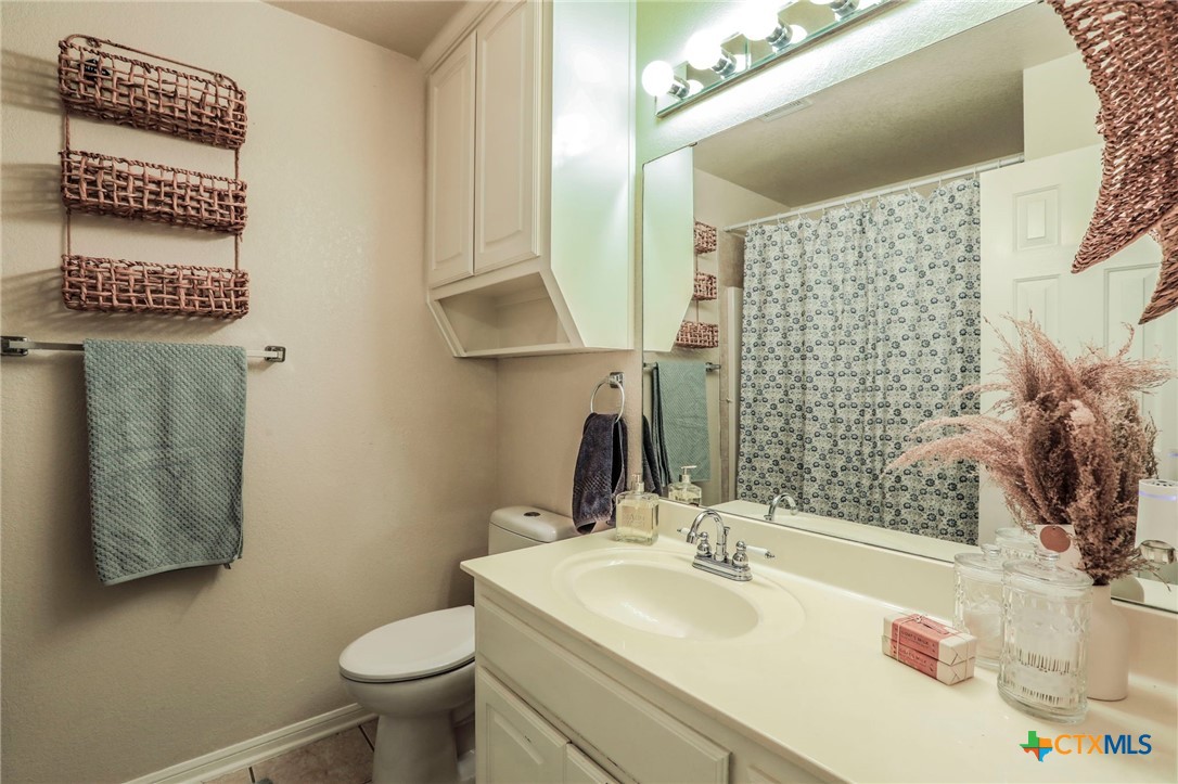 17 South Archer Drive Morgan's Point Resort, TX 76513 - Photo 17 of 30 a bathroom with a sink and a mirror