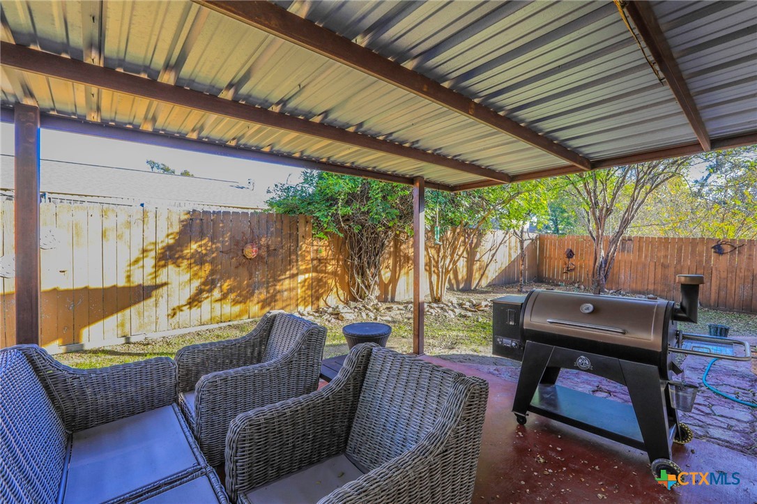 17 South Archer Drive Morgan's Point Resort, TX 76513 - Photo 22 of 30 a outdoor living space with furniture and a fireplace