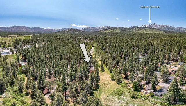 a view of a city with mountains in the background