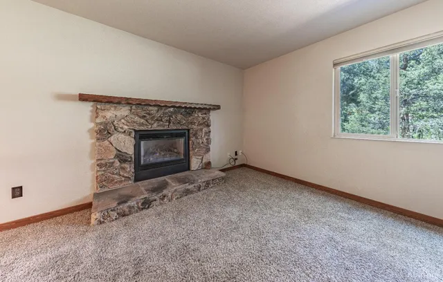 an empty room with a fireplace