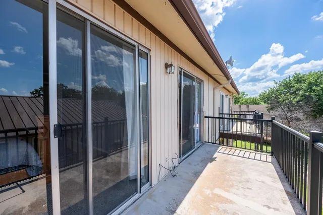 a view of a balcony with a potted plant