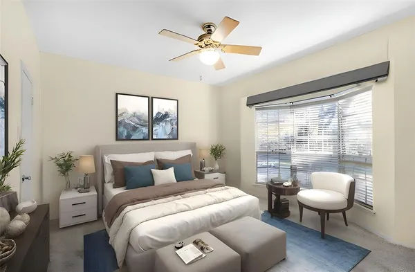 a bedroom with furniture and a window