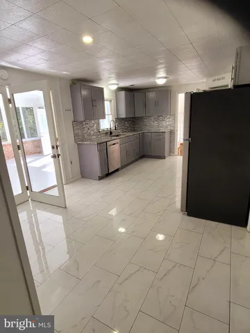 a view of a kitchen with furniture and a kitchen
