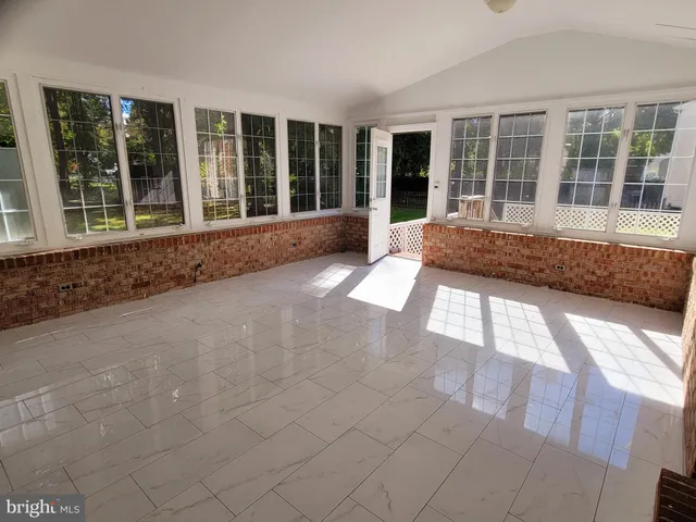 front view of a house with a large window