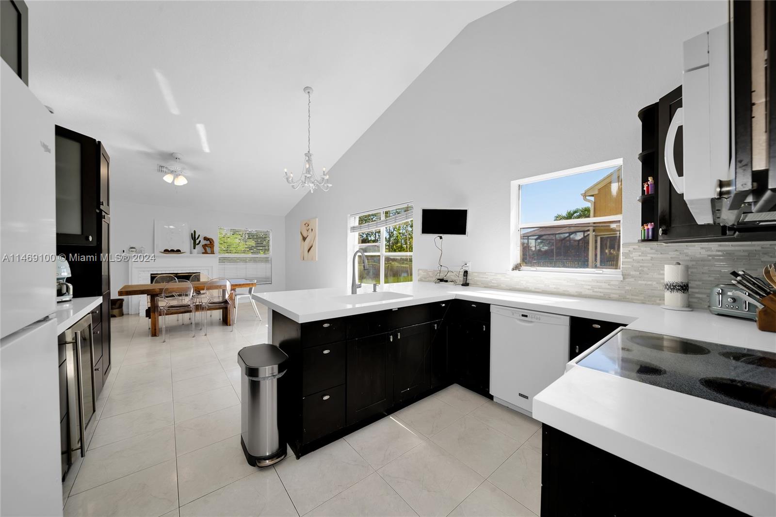 12083 Rockwell Way Boca Raton, FL 33428 - Photo 11 of 47 a kitchen with a sink stove and cabinets
