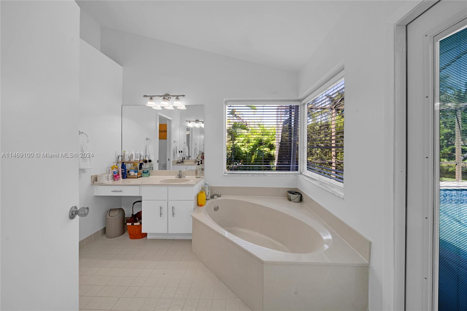 12083 Rockwell Way Boca Raton, FL 33428 - Photo 13 of 47 a spacious bathroom with a tub and sink