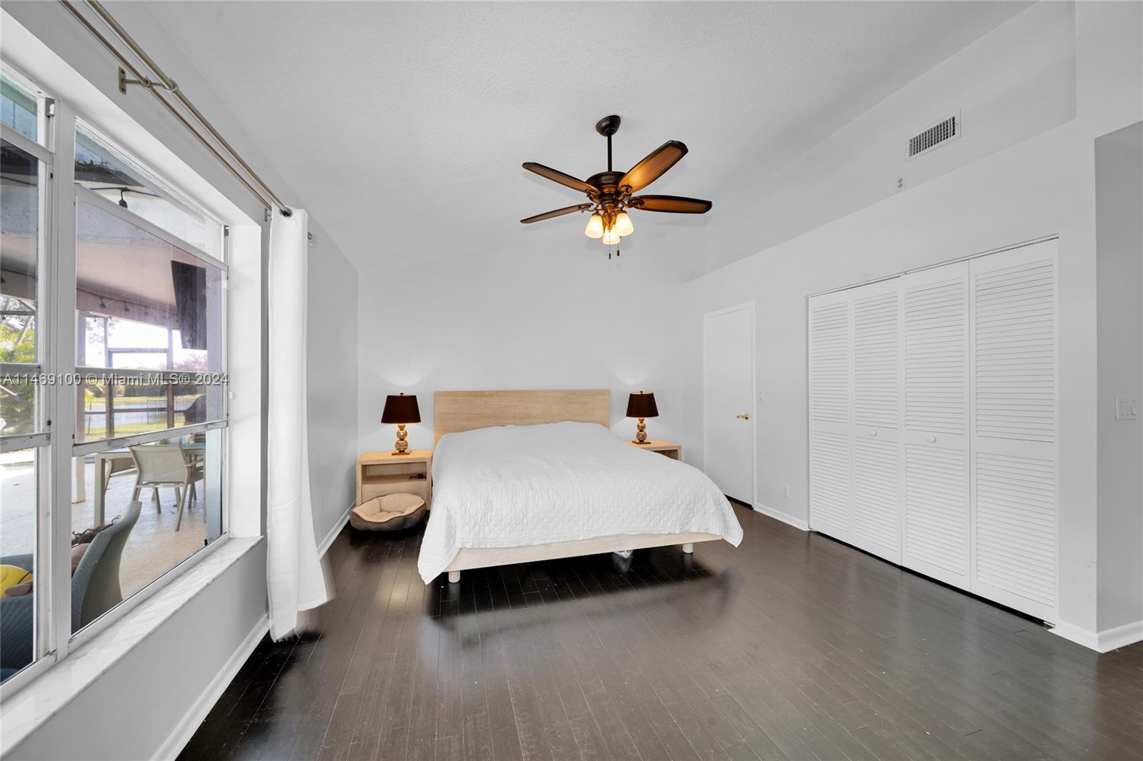 12083 Rockwell Way Boca Raton, FL 33428 - Photo 15 of 47 a bed room with a bed and a chandelier