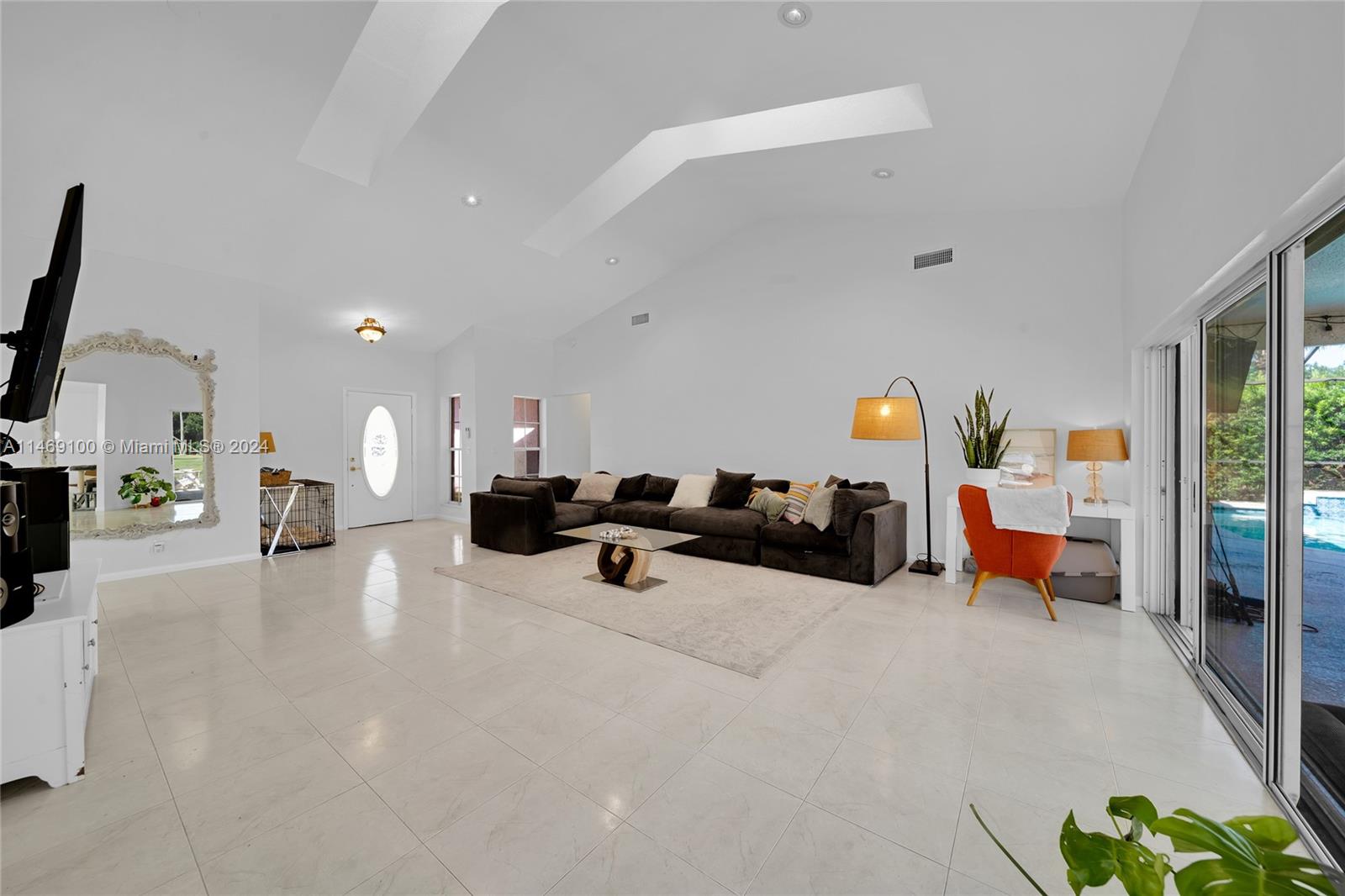 12083 Rockwell Way Boca Raton, FL 33428 - Photo 21 of 47 a living room with furniture and a flat screen tv