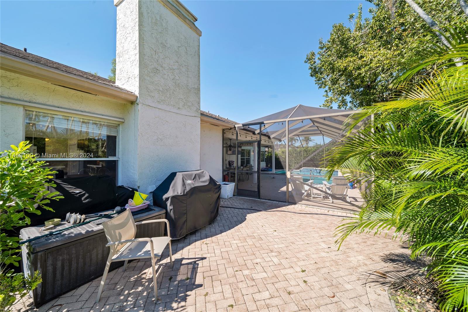 12083 Rockwell Way Boca Raton, FL 33428 - Photo 25 of 47 a view of a patio with couches and potted plants