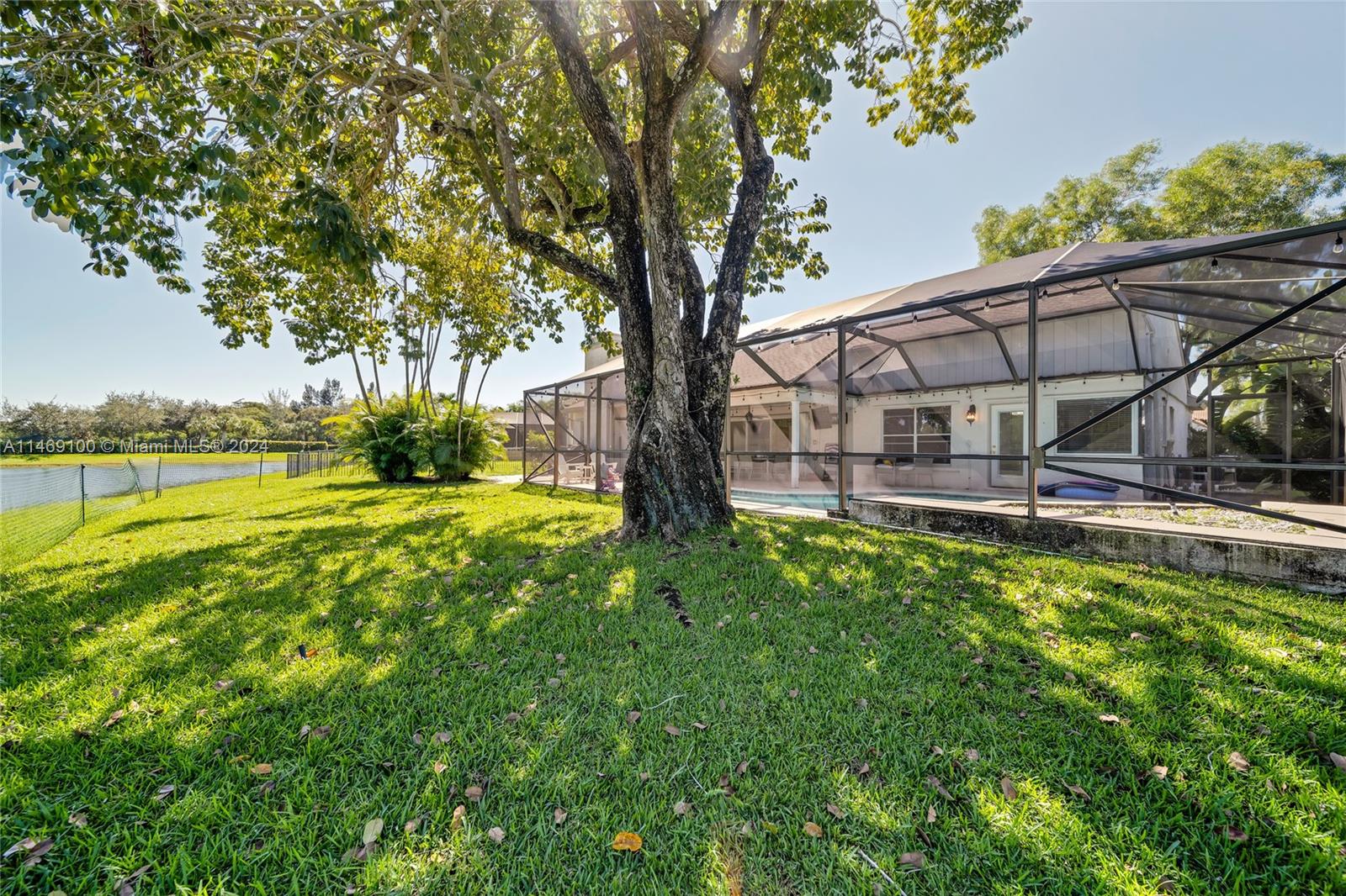 12083 Rockwell Way Boca Raton, FL 33428 - Photo 26 of 47 a view of swimming pool with lawn chairs and wooden fence