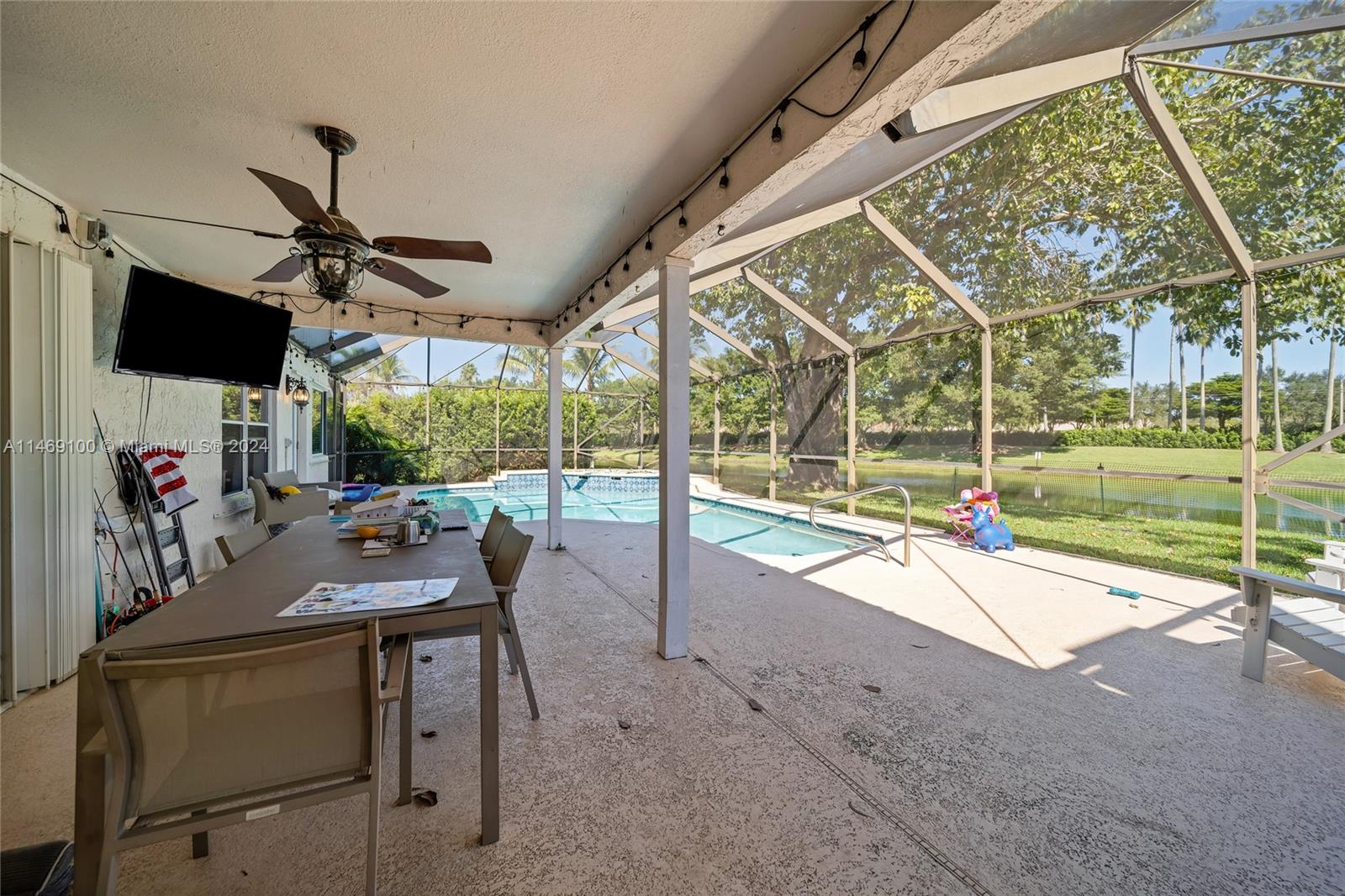 12083 Rockwell Way Boca Raton, FL 33428 - Photo 32 of 47 a view of a patio with a table and chairs