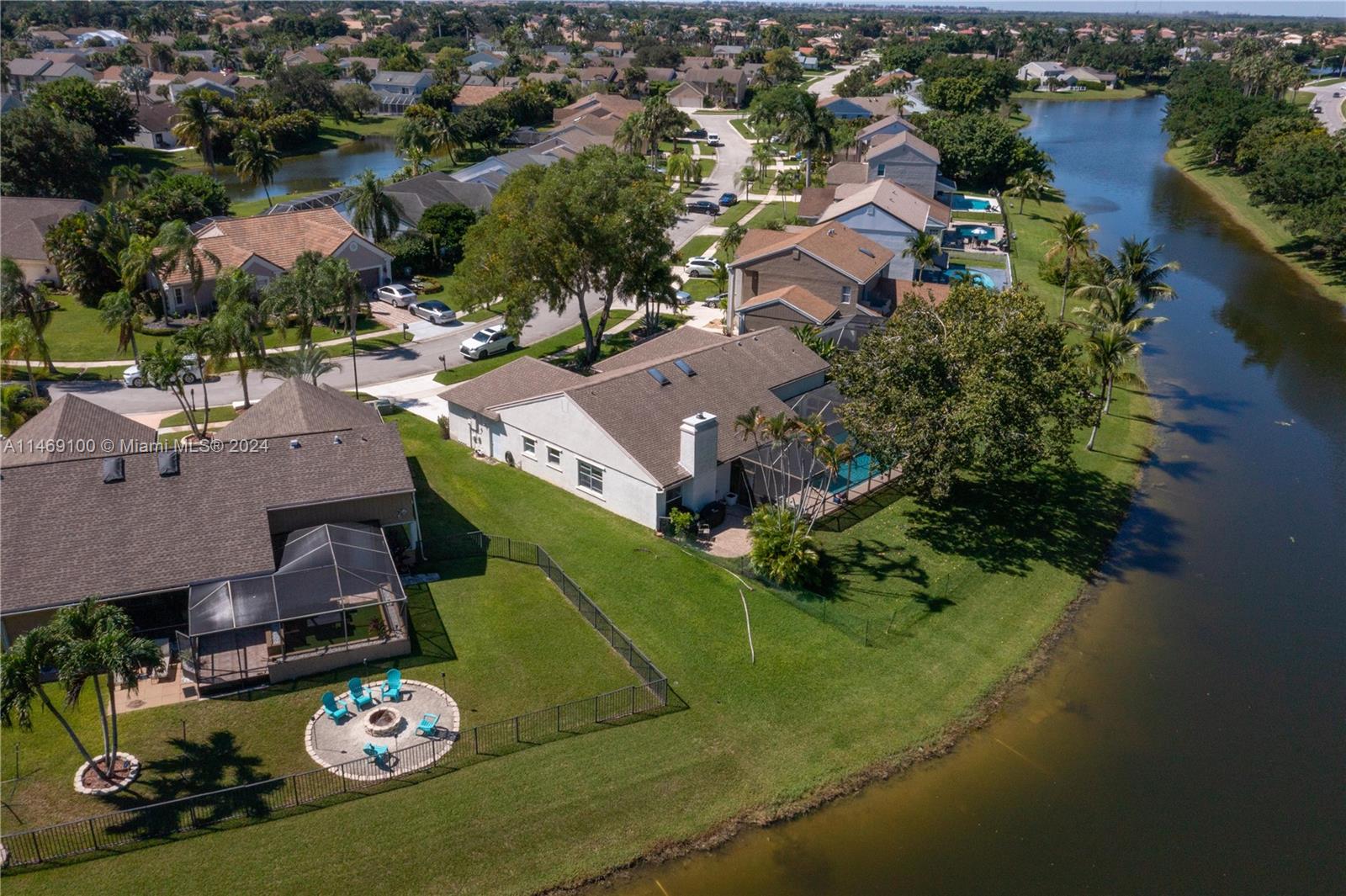 12083 Rockwell Way Boca Raton, FL 33428 - Photo 35 of 47 an aerial view of a house with a garden and lake view