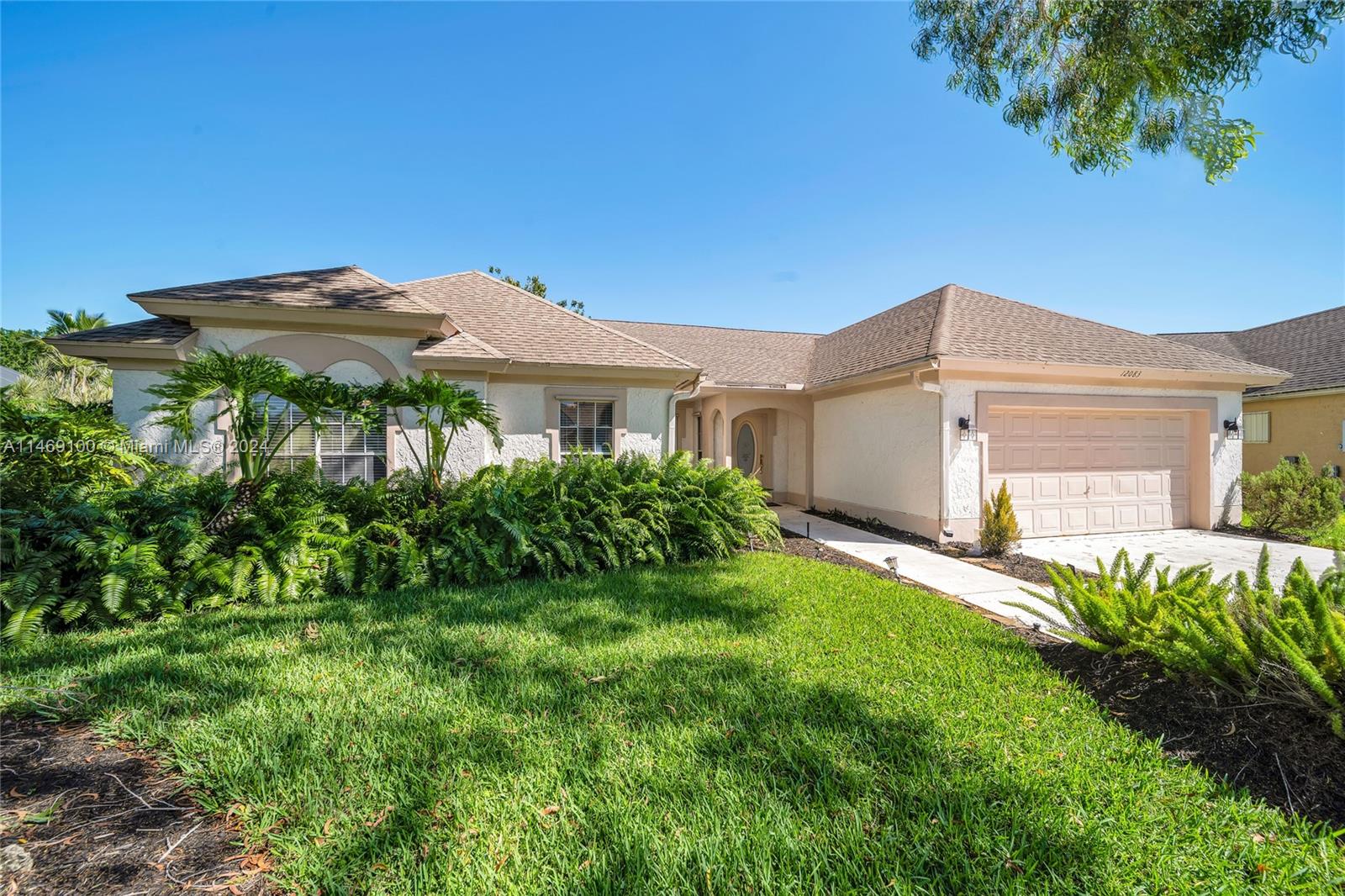 12083 Rockwell Way Boca Raton, FL 33428 - Photo 5 of 47 a view of a house with a yard