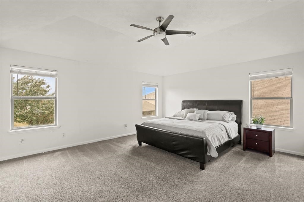 6719 Path Way Court Katy, TX 77449 - Photo 21 of 35 a bedroom with a bed and window