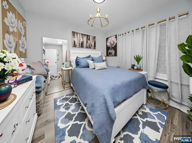 a bedroom with bed and a window