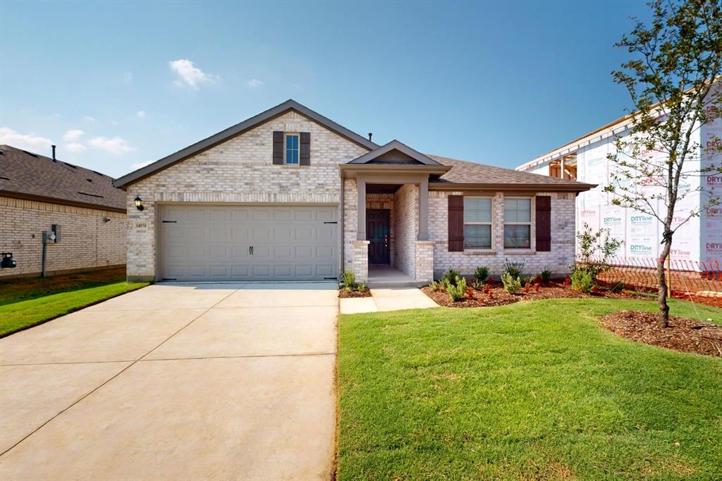 a view of a house with yard and tree s
