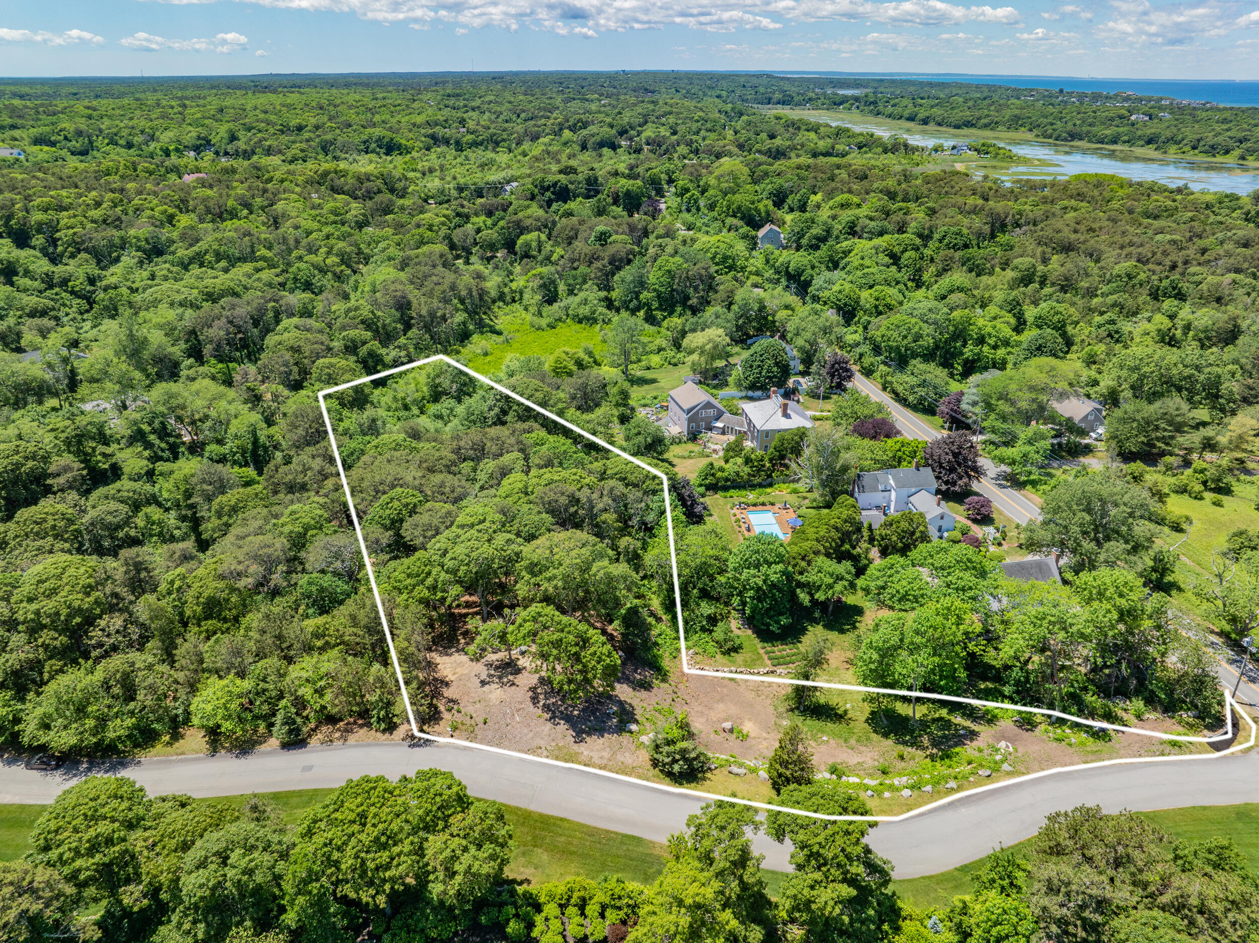 0 Ridgewood Drive Brewster, MA 02631 - Photo 26 of 42 a view of a yard with a house in the background