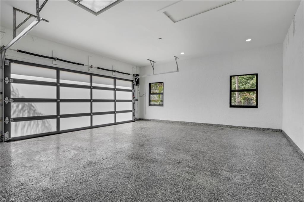 730 29th Street Southwest Naples, FL 34117 - Photo 35 of 50 Garage with baseboards and recessed lighting