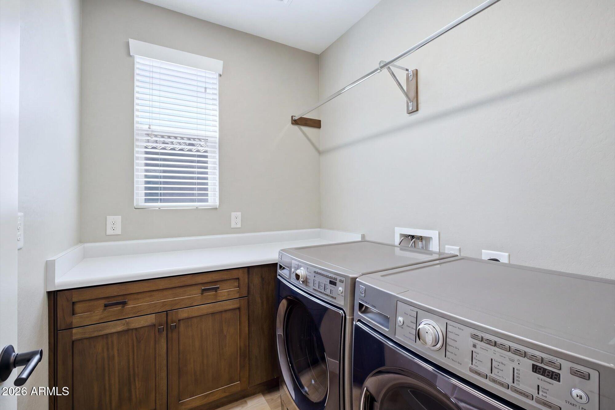 16849 West Merrell Street Goodyear, AZ 85395 - Photo 26 of 35 a utility room with dryer and washer