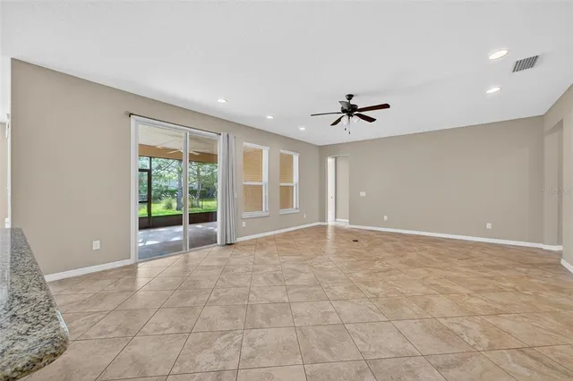 a kitchen with granite countertop a sink and a stove