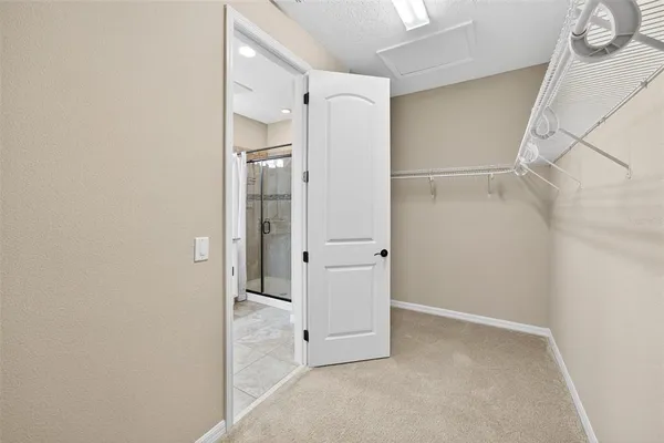 a view of a room with stairs and white walls