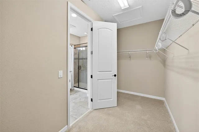 a view of a room with stairs and white walls